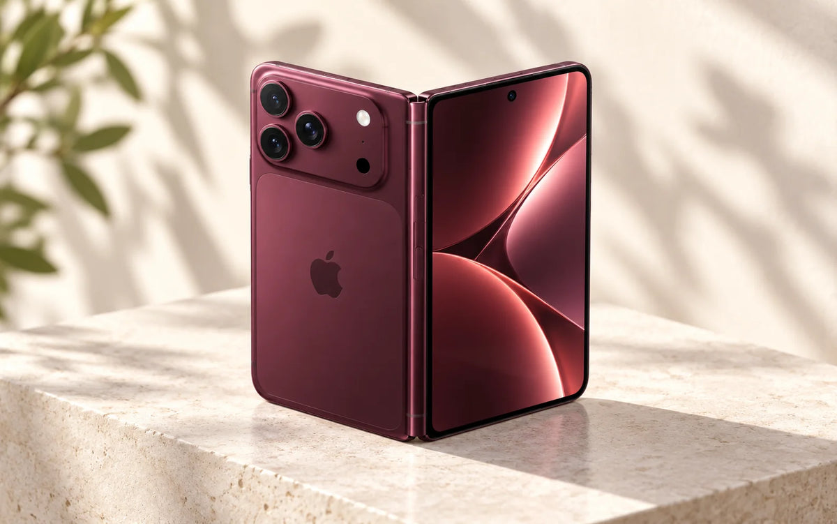 Burgundy foldable iPhone concept shown partially open on a sunlit stone surface; not an official product image.