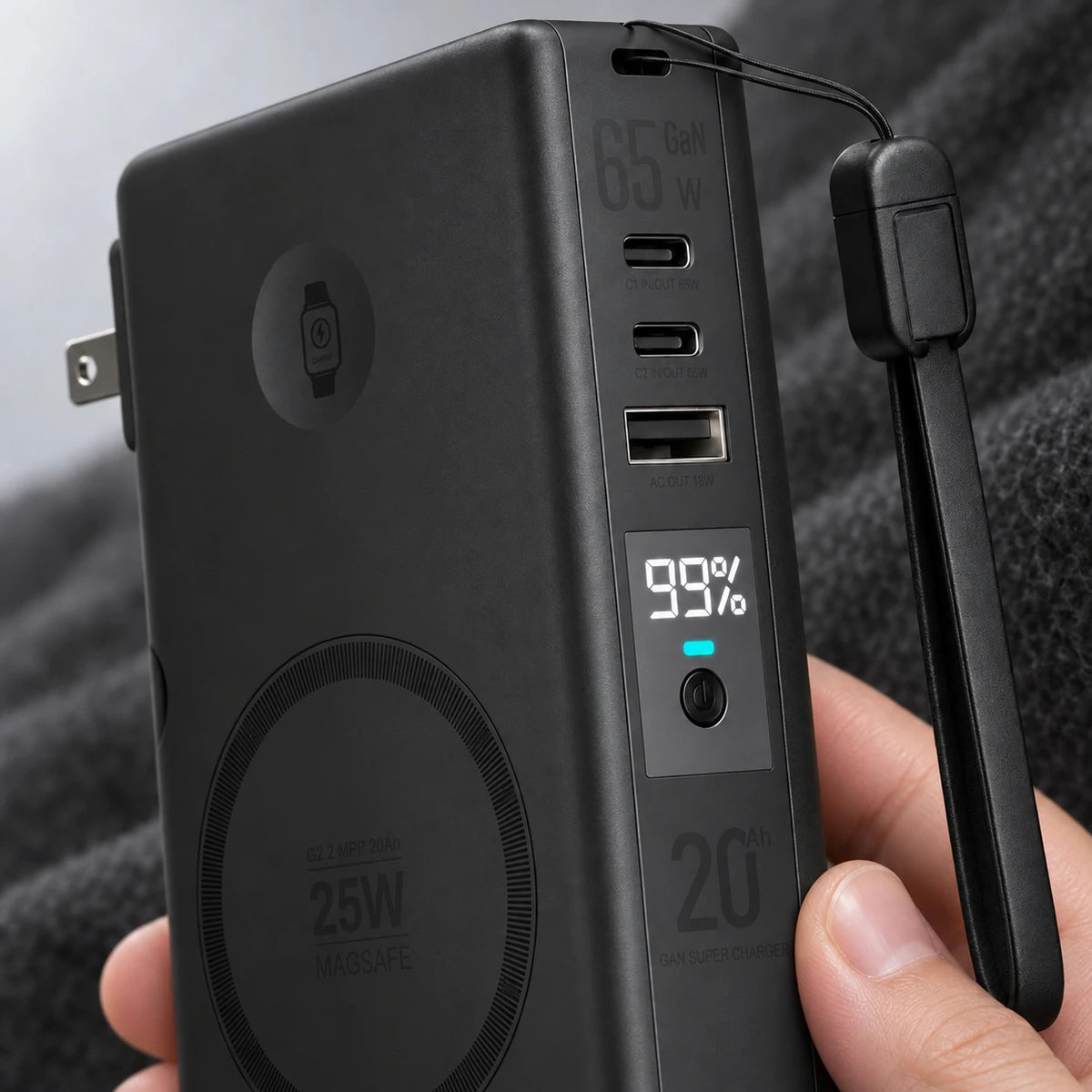 Close-up of the remaining charge display and ports on a black portable battery.